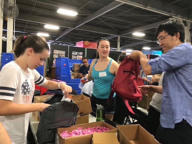 Students fill backpacks