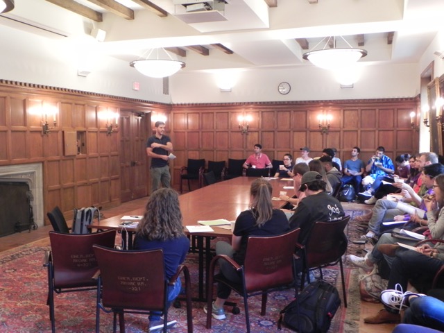 Graduate student Jesús Dones-Monroig stands before about 35 interested members of the department.