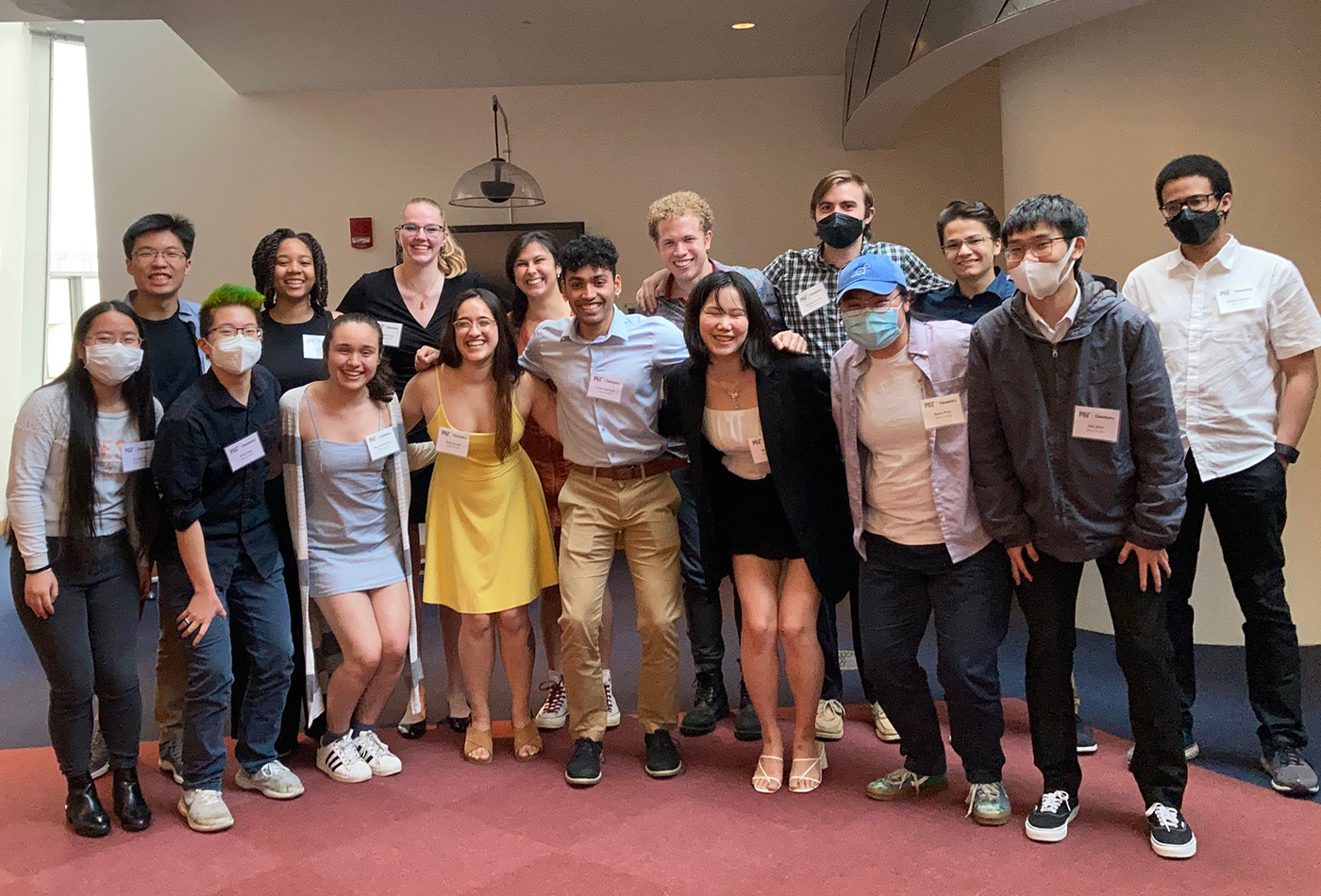 A group of students smile together.