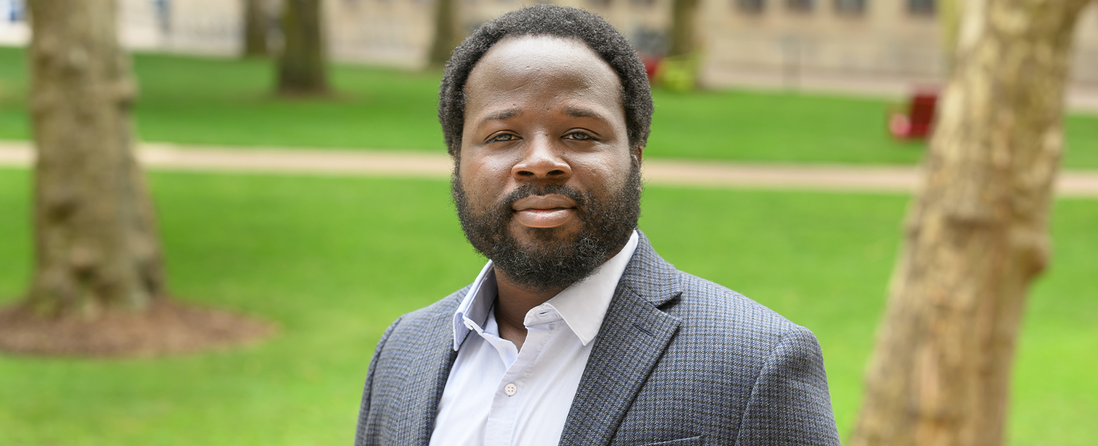 Robert Gilliard smiles in an outdoor setting.