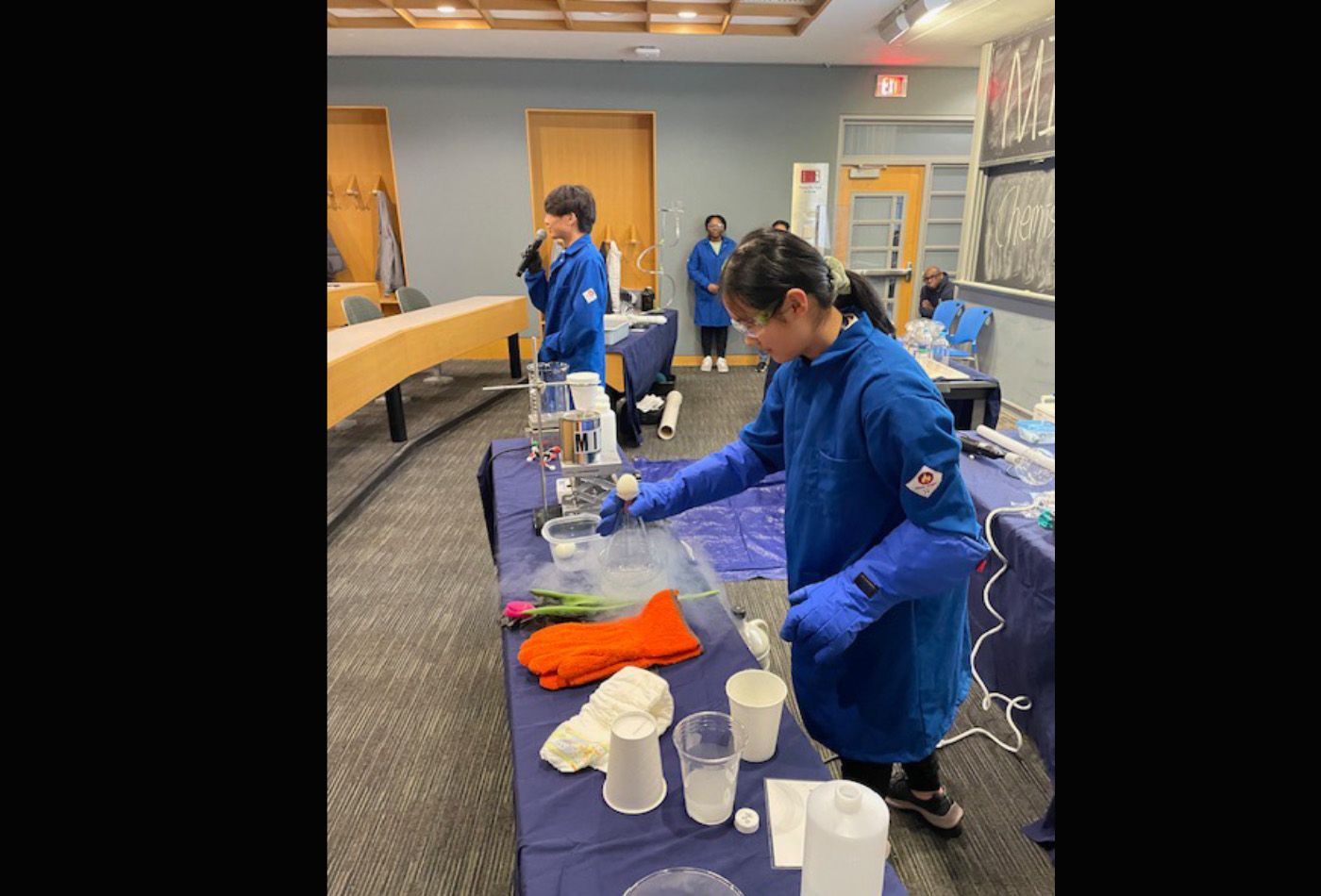 A group of students conduct magical experiments in a classroom.