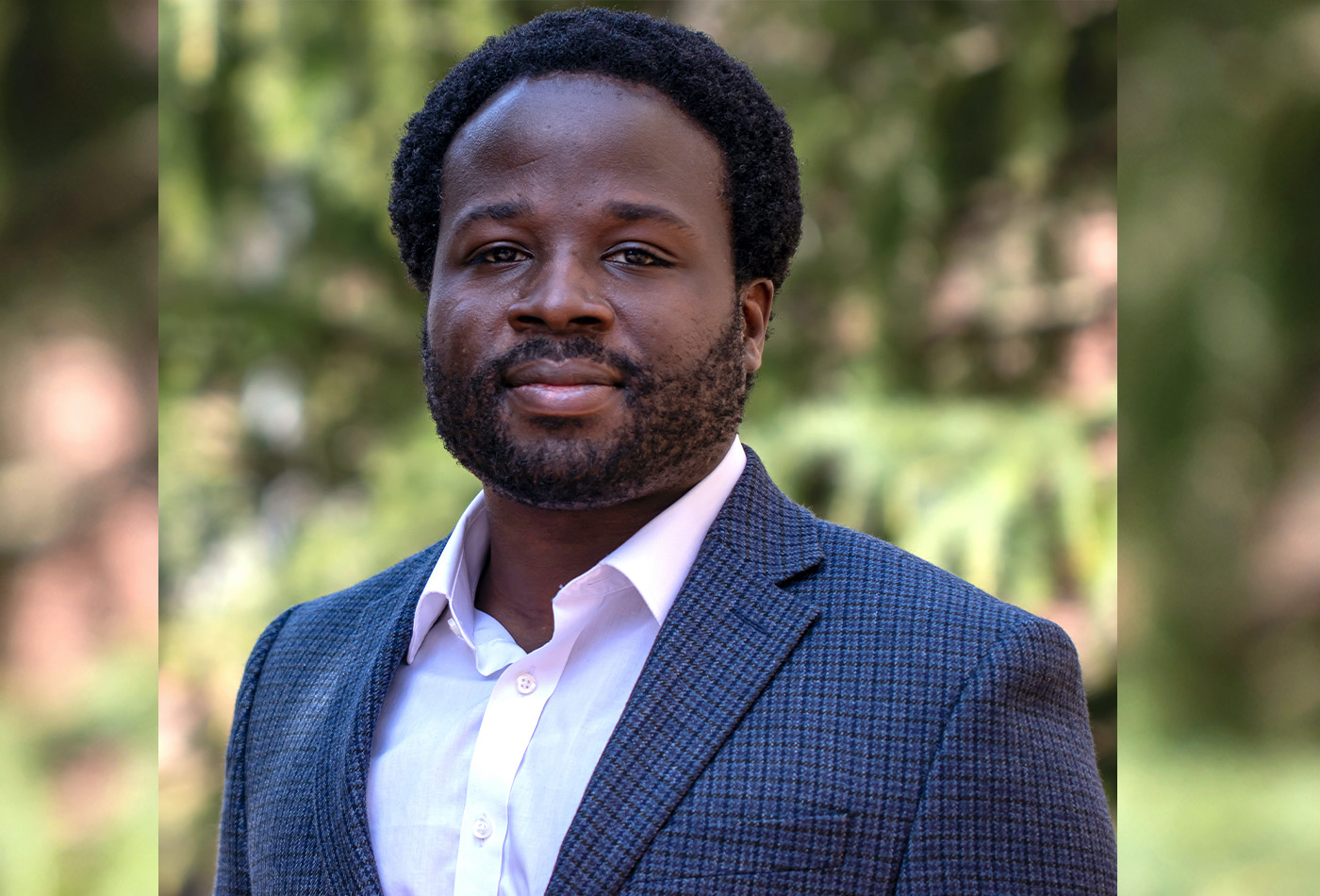 Robert Gilliard smiles in an outdoor setting.